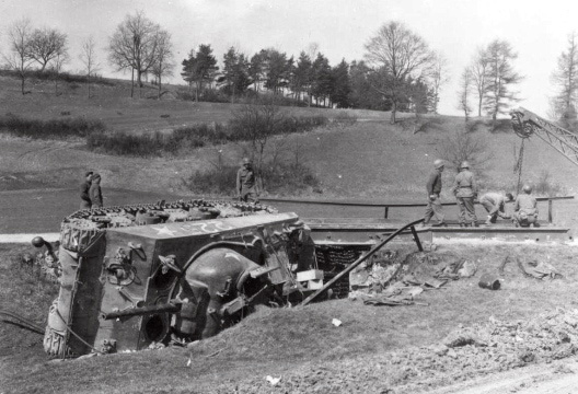 56th Engineers work to replace bridge which gave away.