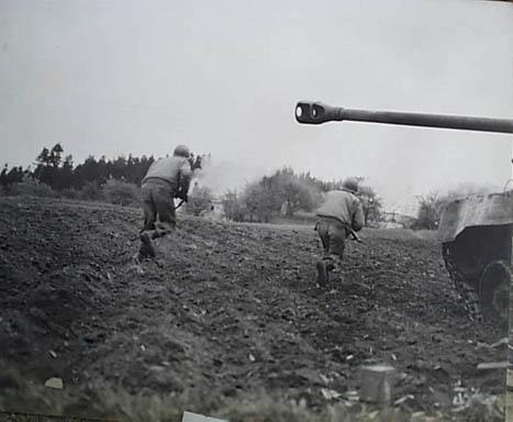 11th Armored tank covering infantry men near Neufeld Austria, May 4 1945.